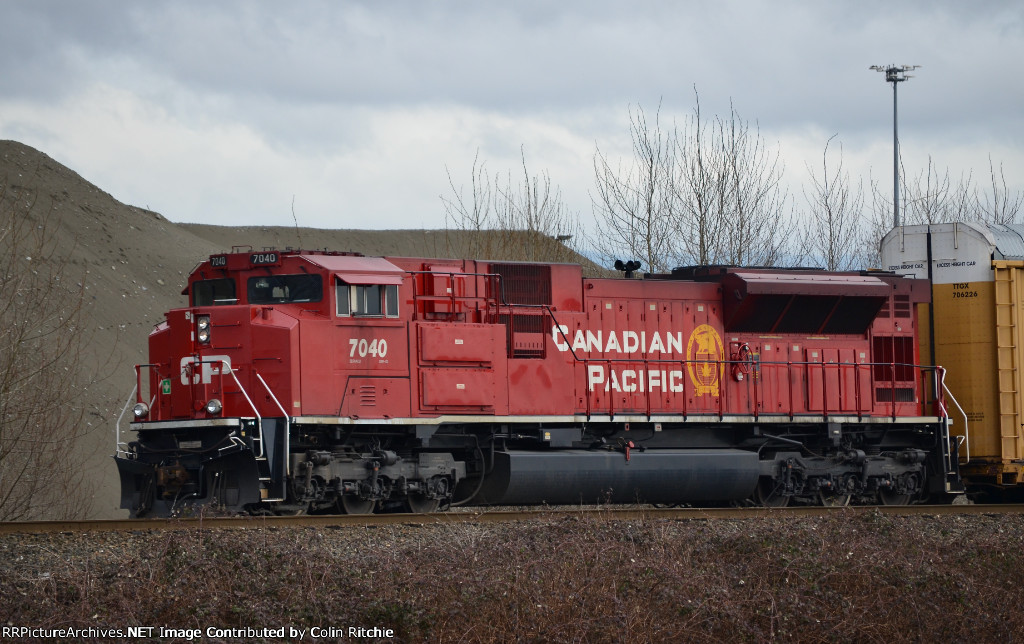 Trailing DPU, CP 7040 E/B approaching Kennedy Road crossing, to the west of the PoCo Intermodal Yard